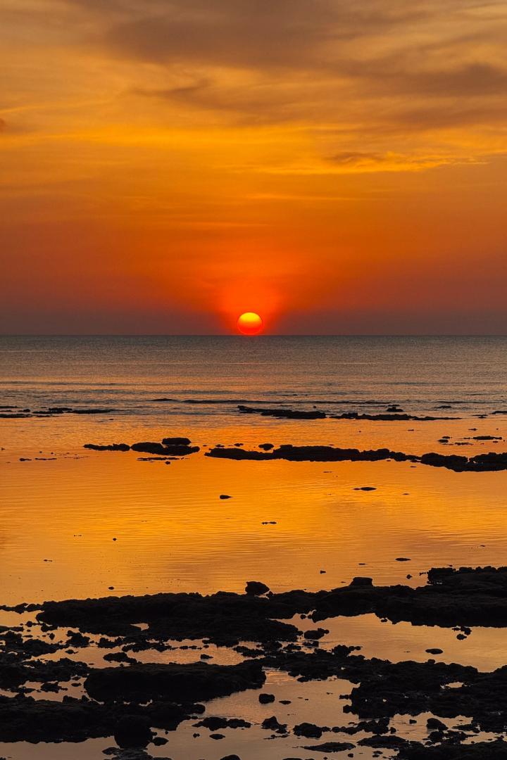 sunset on the beach in koh lanta, thailand