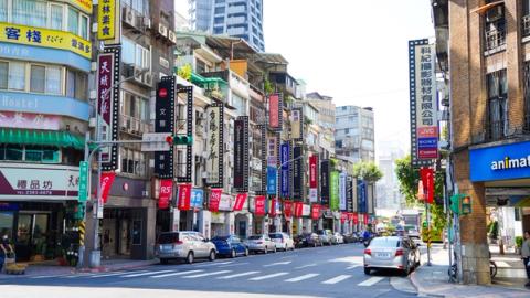 buildings along a street in taipei, taiwan