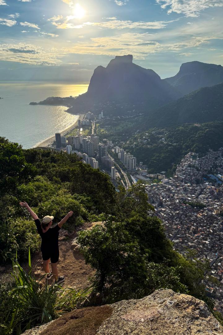 woman looking at the view one the hike up dois irmaos in rio de janeiro, brazil