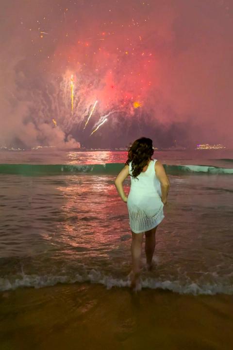 woman celebrating new years eve in rio de janeiro, brazil
