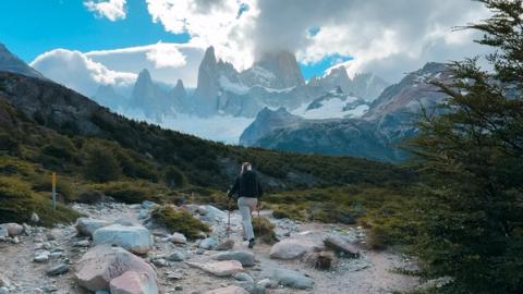 woman hiking to fitz roy in el chalten, argentina