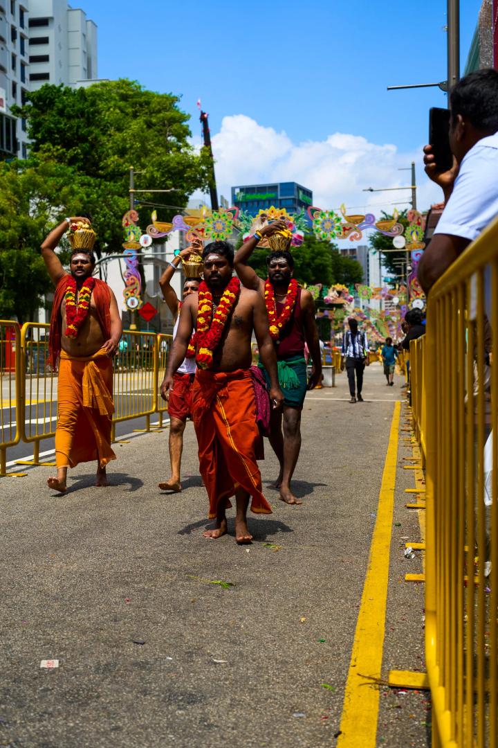People walking in traditional clothes during a Hindu festival in Little India in Singapore