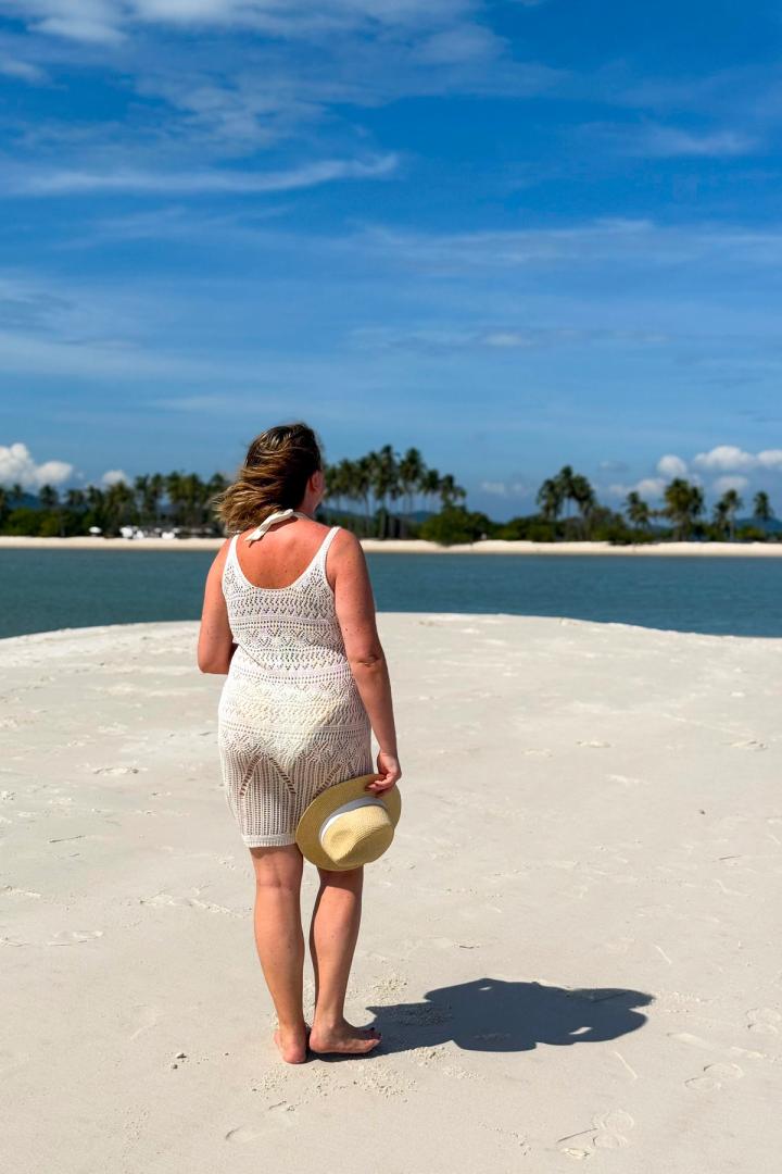 woman walking on the beach on koh yao yai in thailand