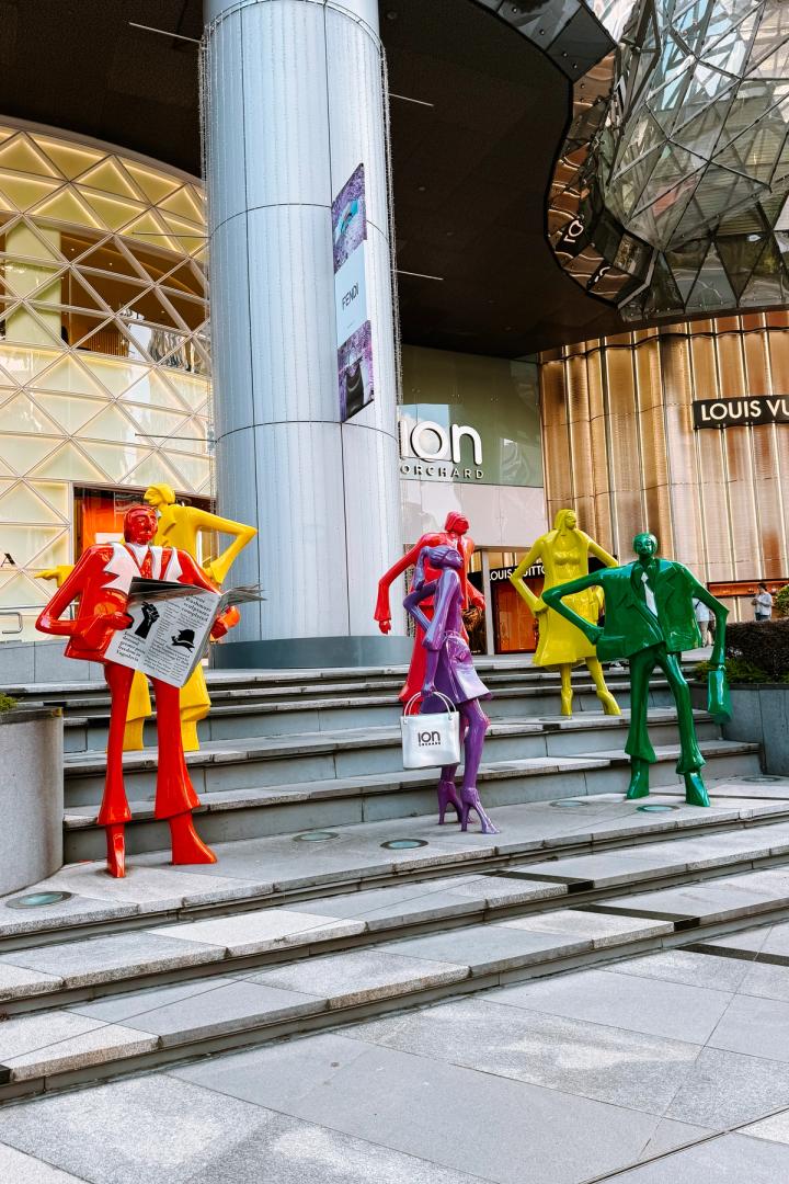 colourful statues of people in orchard street, singapore