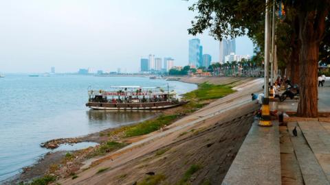 a cruise boat waiting along the river side in Phnom Penh, Cambodia