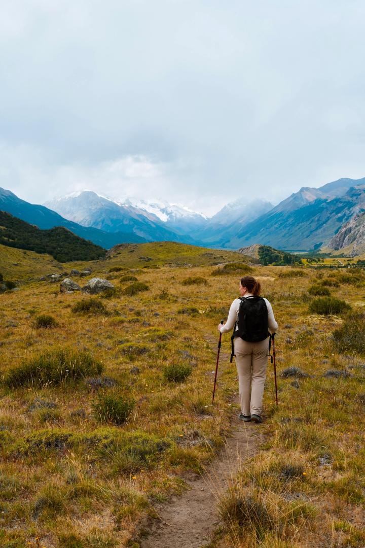 woman hiking to Laguna Torre in El Chaltén, Argentina