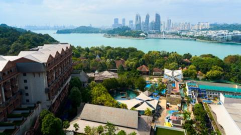 view of Singapore skyline and a waterpark on sentosa island, Singapore