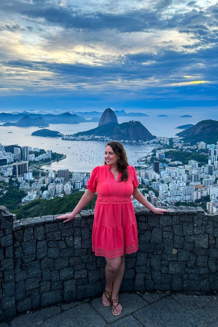 woman watching the Sunrise at Mirante Dona Marta in rio de janeiro, brazil