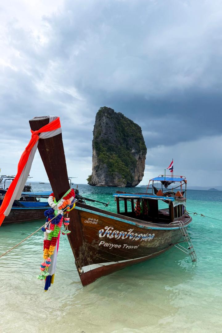 a longtail boat in the water in krabi, thailand