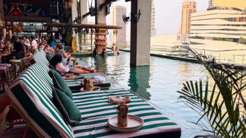 people relaxing at tribe pool bar in Bangkok, Thailand