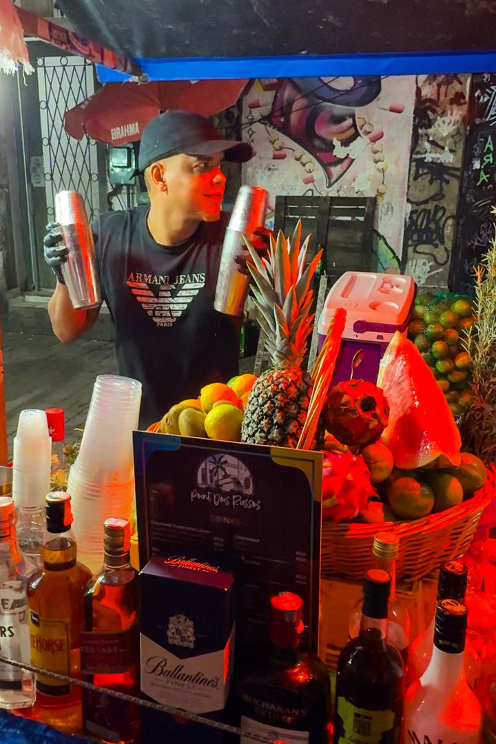 man making drinks at pedro do sal in rio de janeiro, brazil