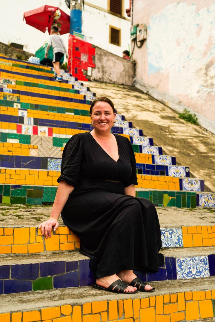 woman sitting in the selaron steps in Rio de Janeiro, brazil