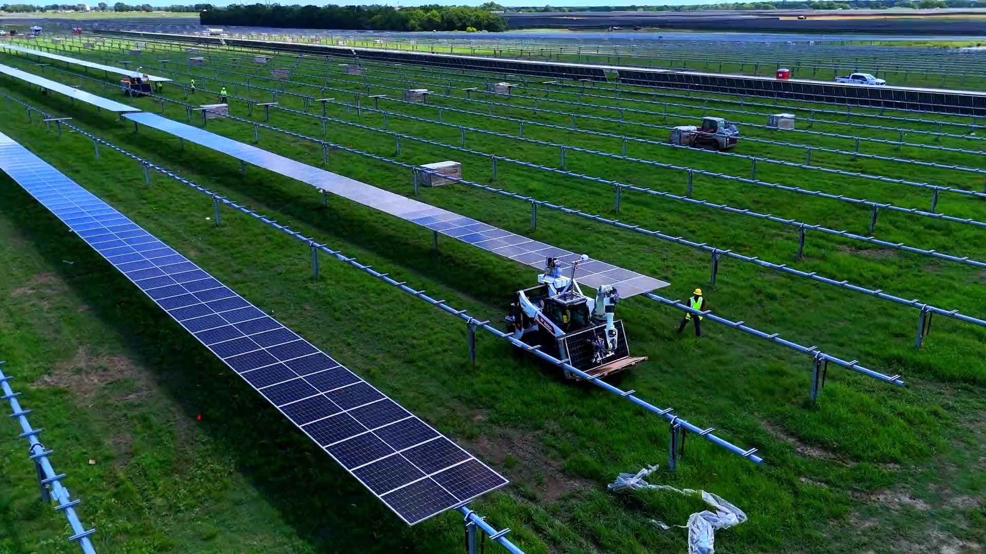 Gritt machine working rows of a solar farm