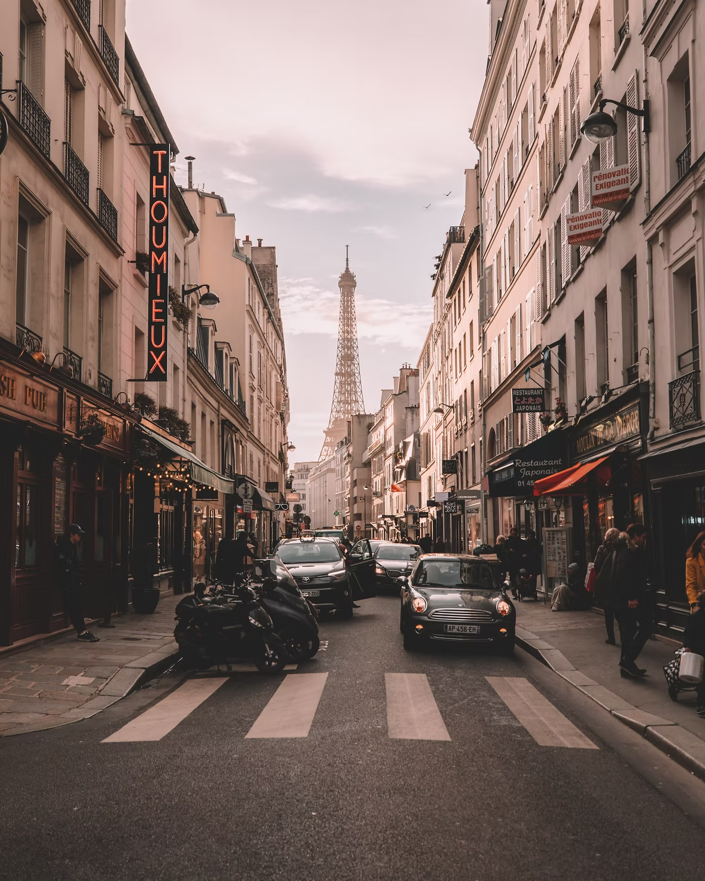 A Parisian street with the Eiffel Tower in the distance