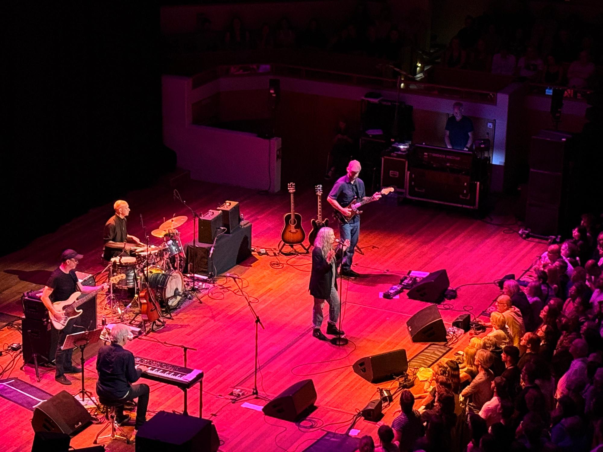 Patti Smith with band on stage