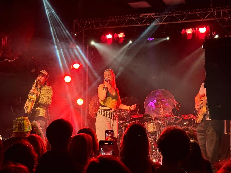 RUBII with saxophonist on the left, drummer behind her and a guitarist on the right