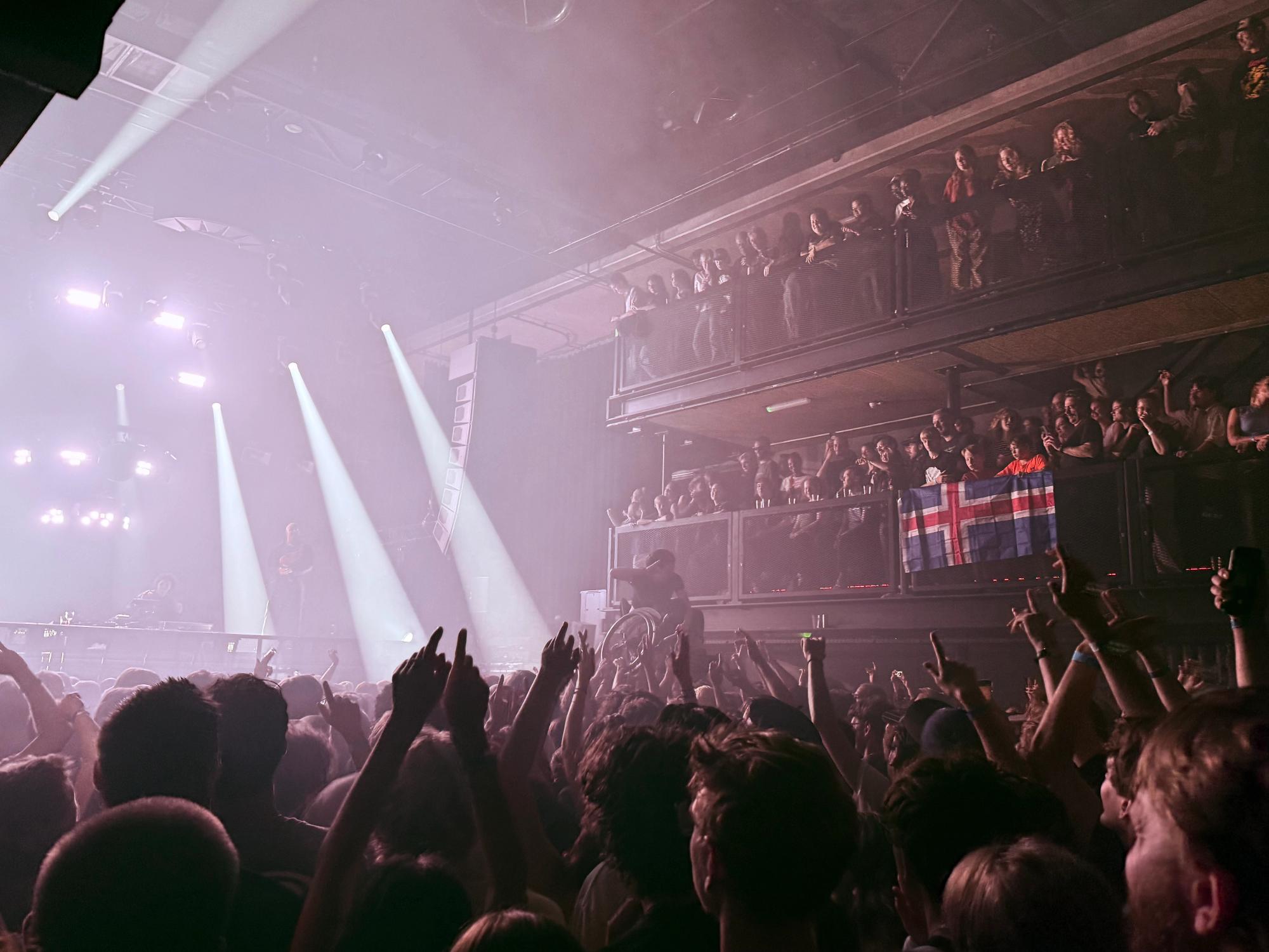 crowd, islandic vlag , someone in a wheelchair is crowdsurfing
