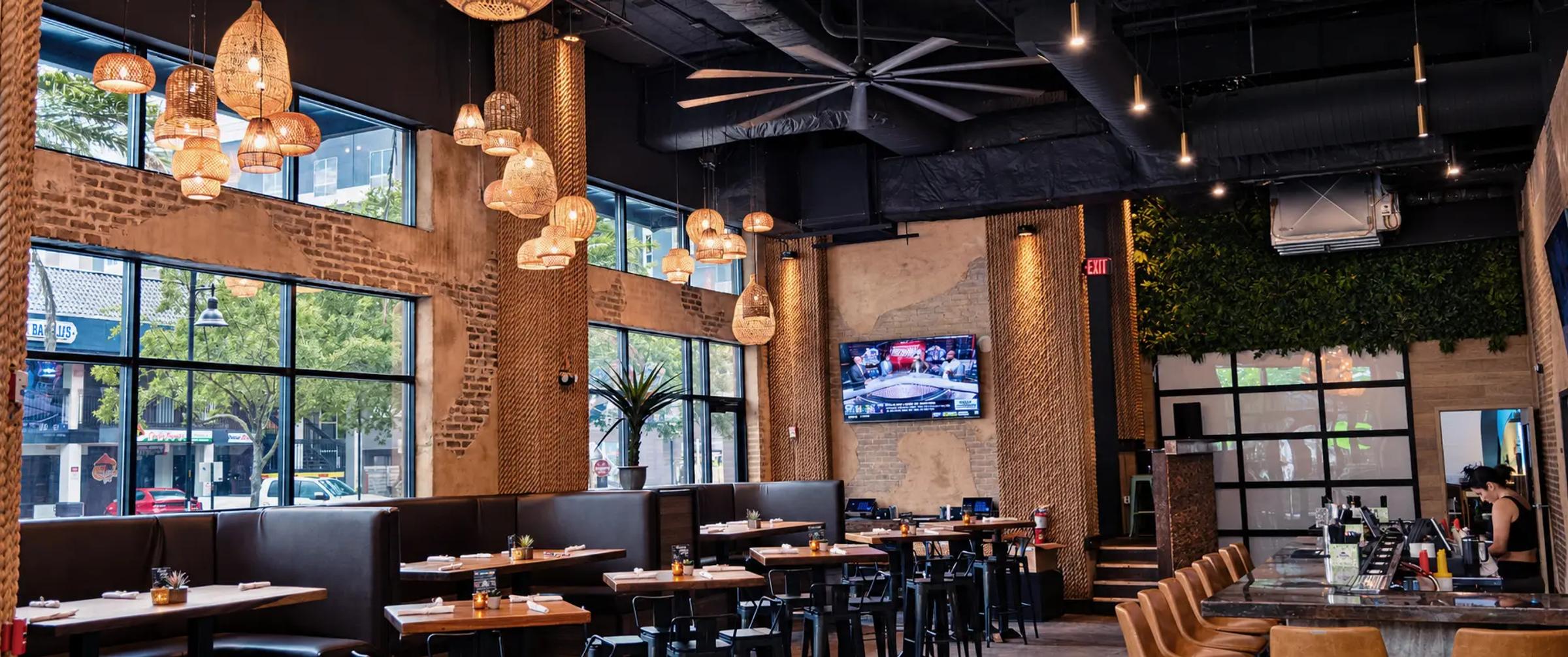 The Cantina Añejo dining room under woven pendant lights