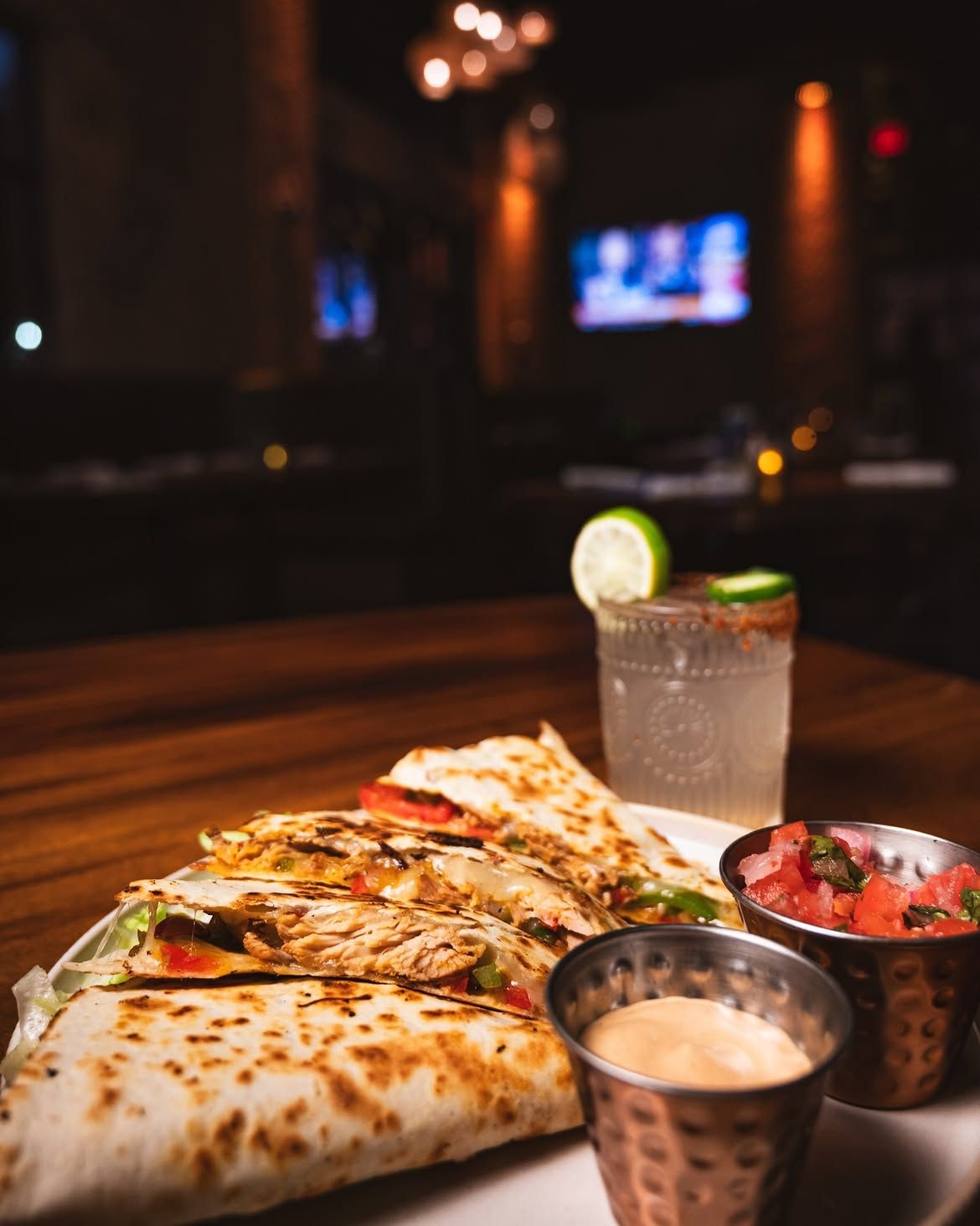 Chicken quesadilla with pico de gallo, crema and a margarita at Cantina Añejo