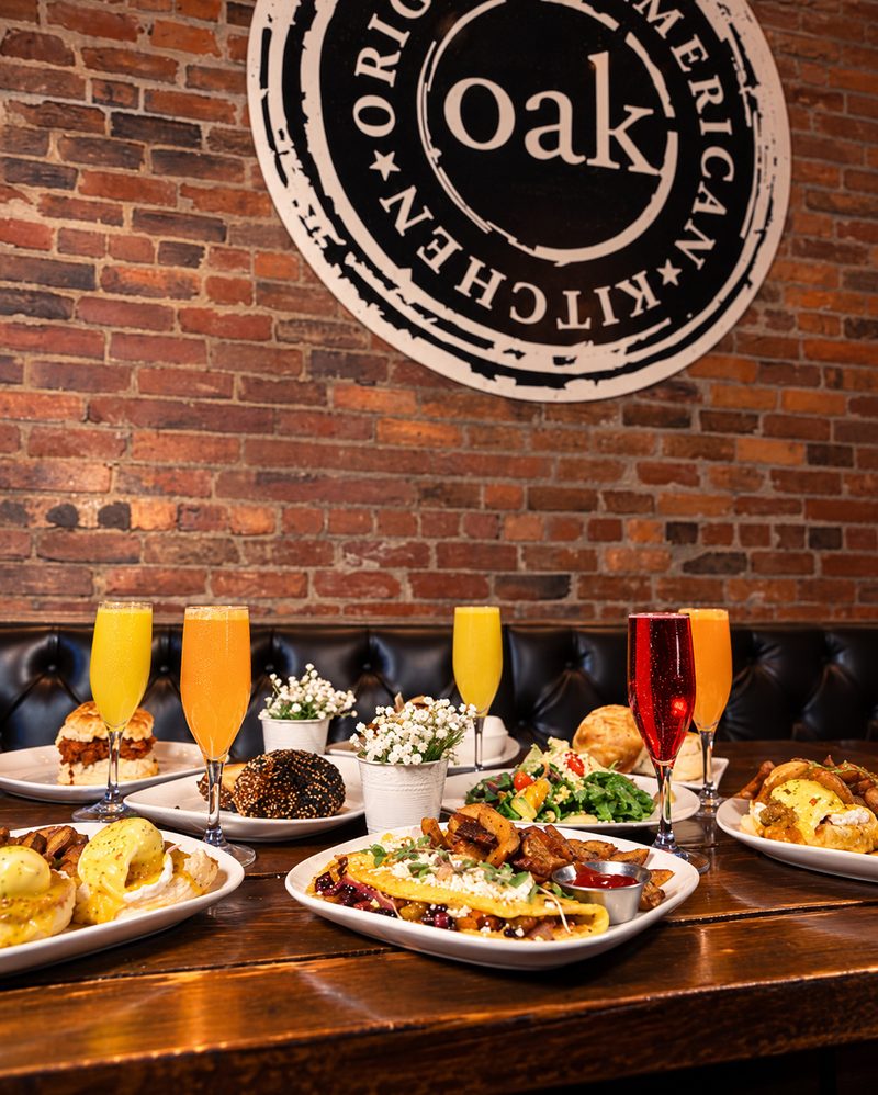 Mimosas and the brunch spread beneath the OAK seal