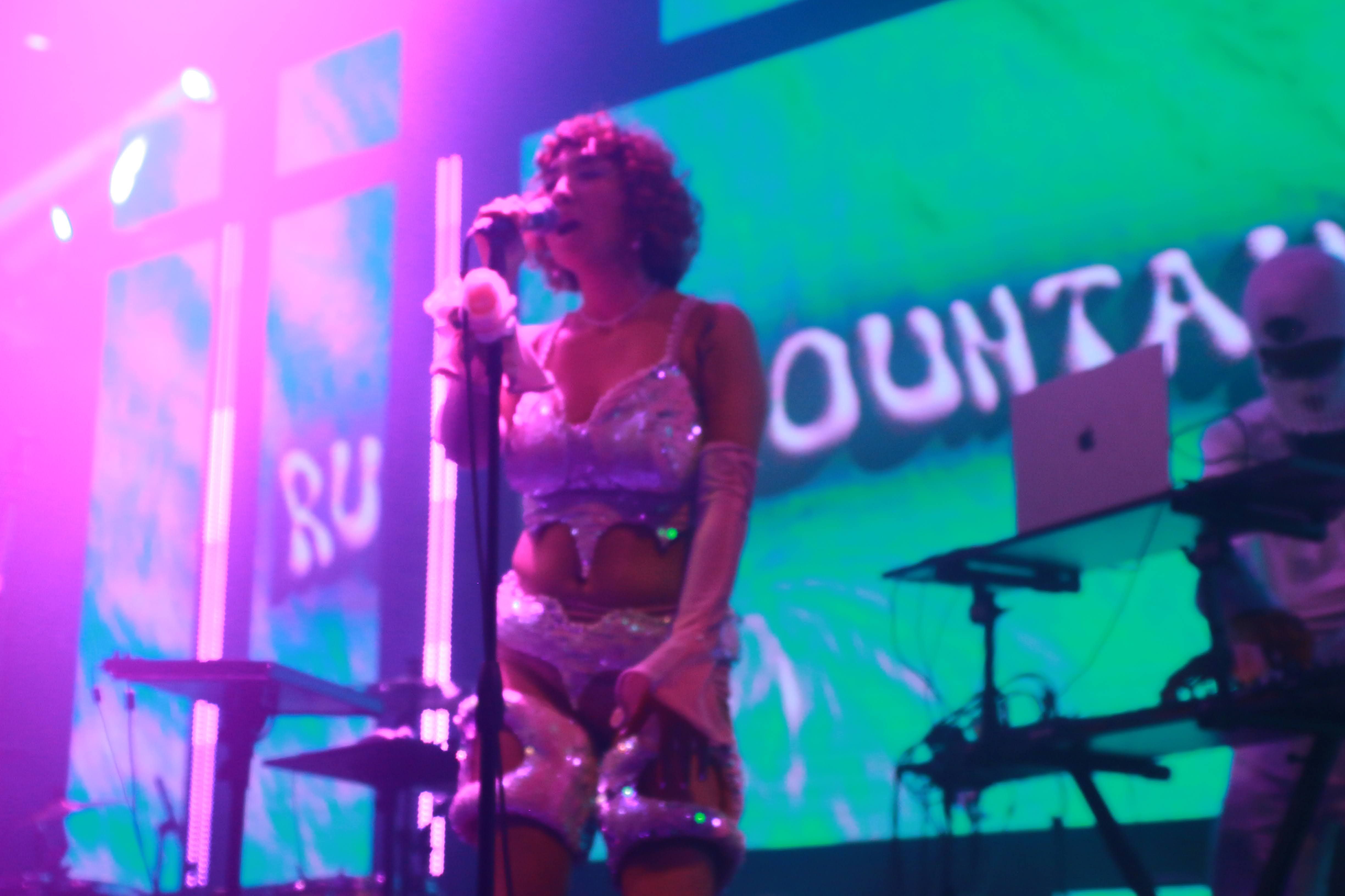 Ruby Mountain performing live in Hollywood, singing and producing dance music with a cosmic vibe from Venus.