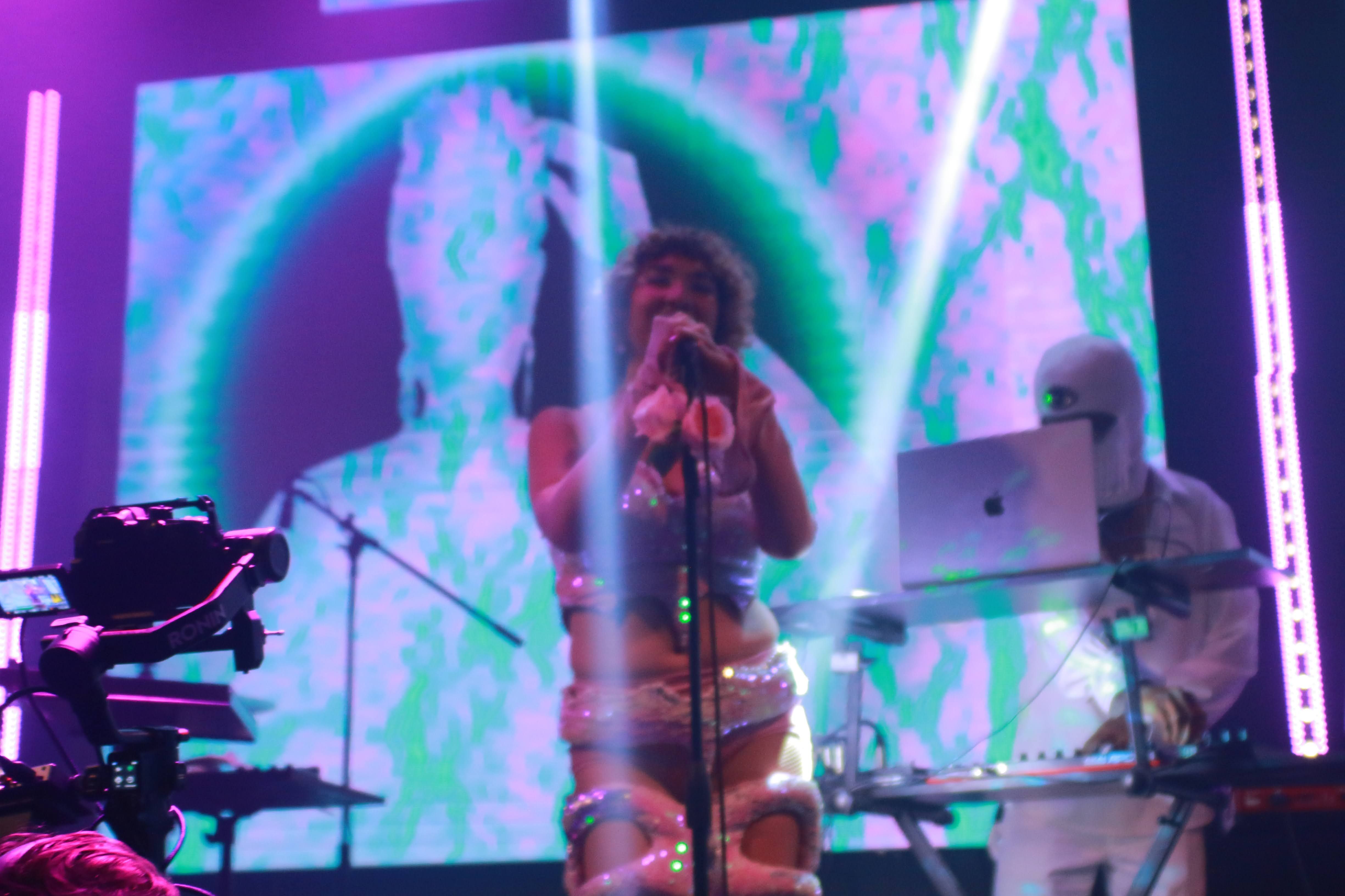 Ruby Mountain performing live in Hollywood, singing and producing dance music with a cosmic vibe from Venus.