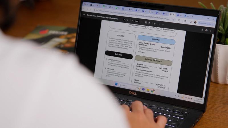 Student reviewing a resume on a Dell laptop during a Freire Charter School Wilmington career readiness session