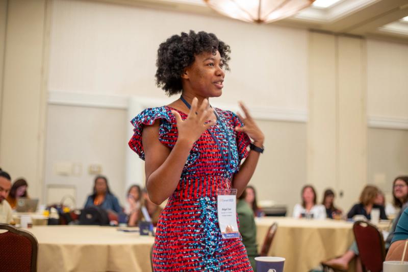 Conference speaker presenting at GDConnect 2023, photographed by Meridian Media