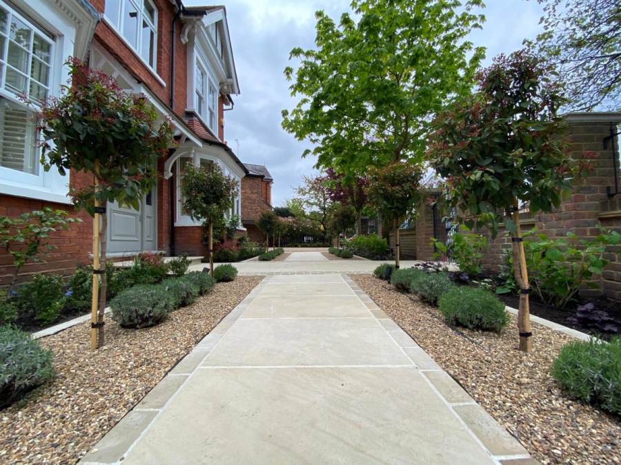 Stone driveway and planted front garden path designed by Landscape Artisan