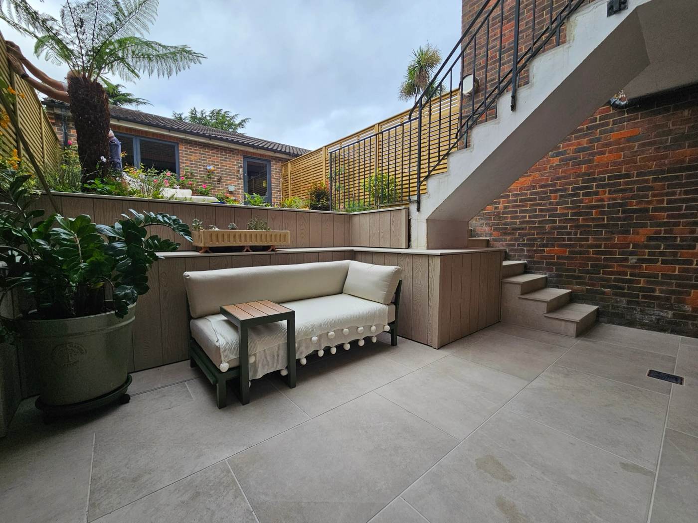 Beautifully landscaped garden with natural planting and stone terrace