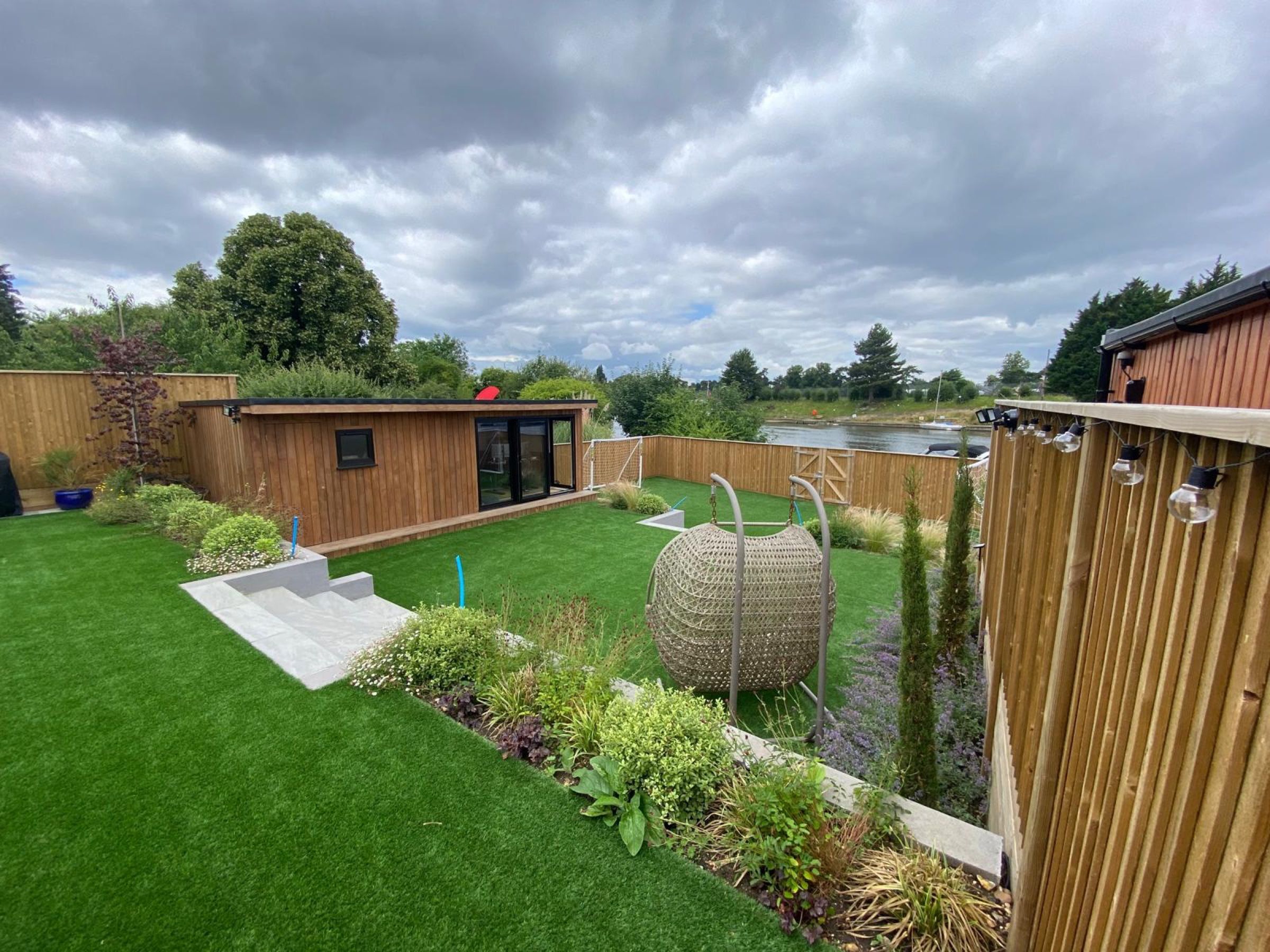 Contemporary porcelain tile terrace with garden planting