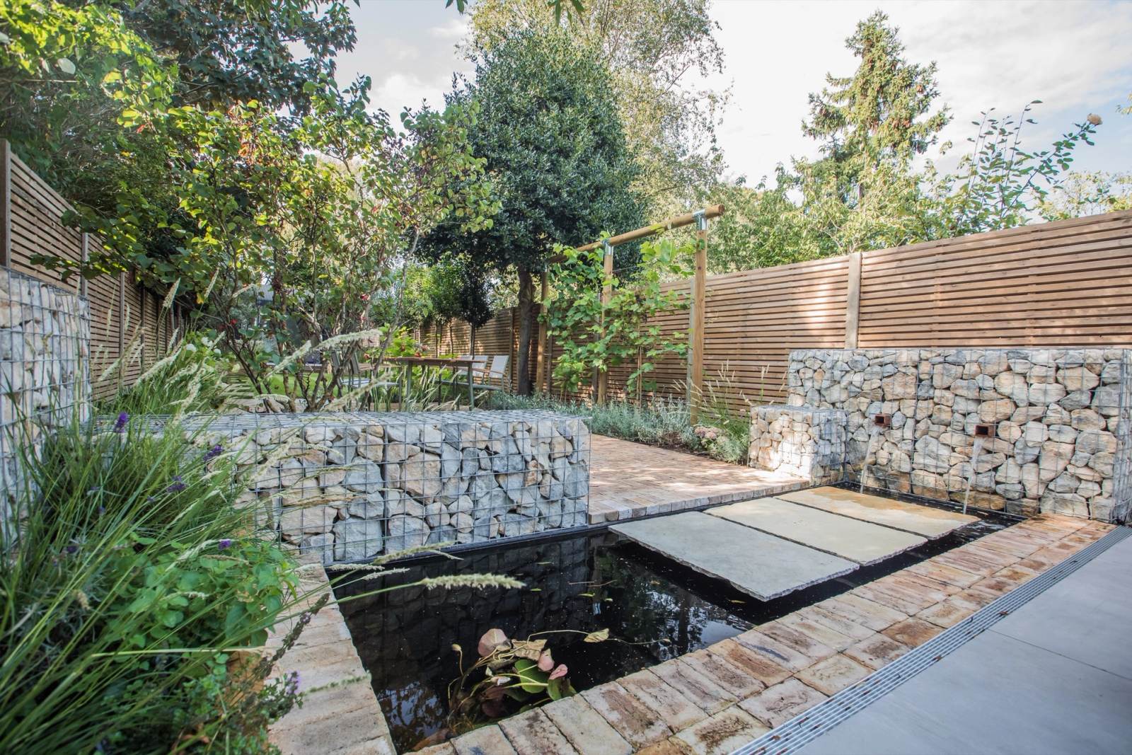 A finished garden with layered planting and stone detailing