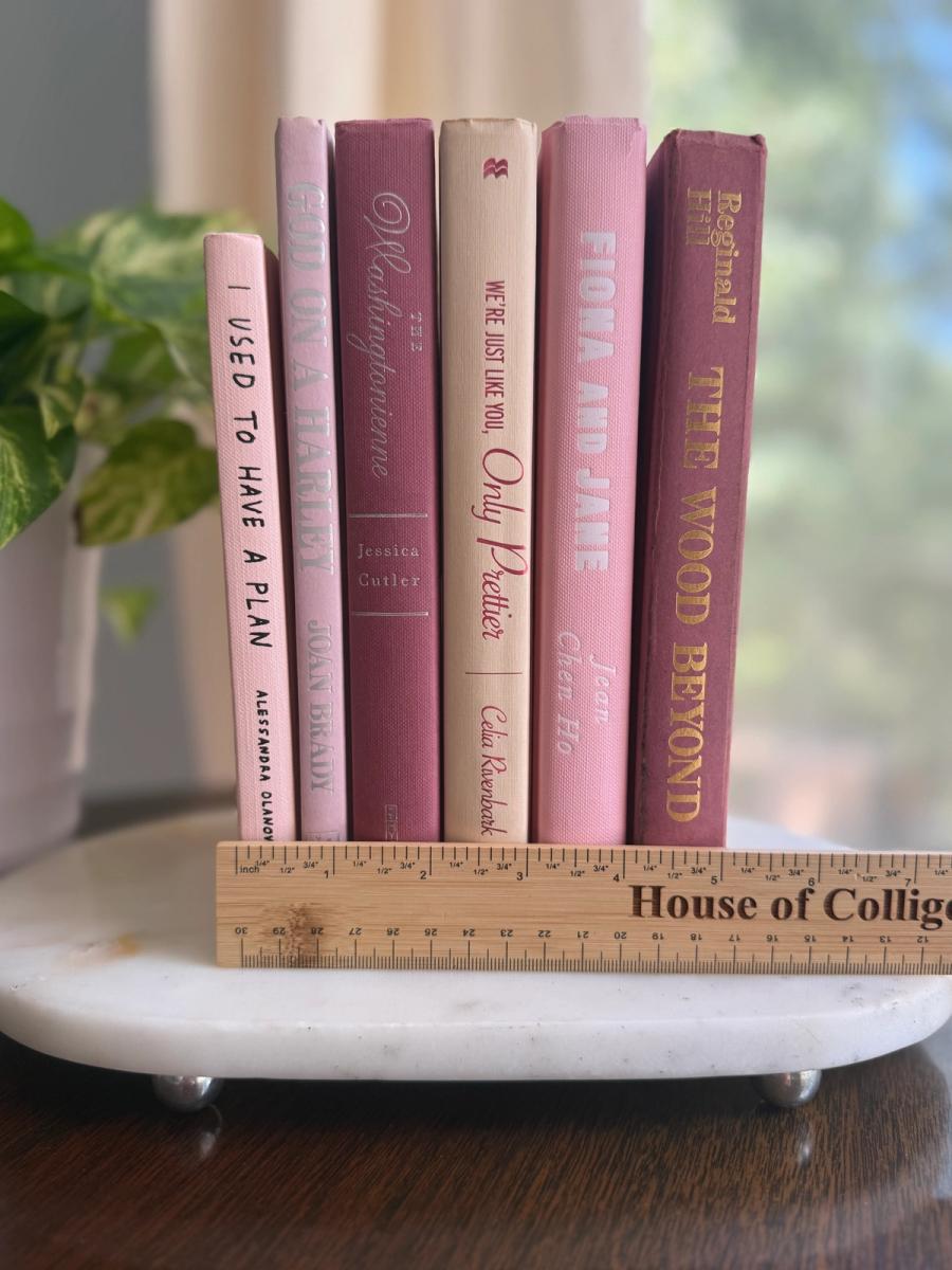 Curated collection of blush, dusty rose, warm taupe, and softly muted neutral books.
