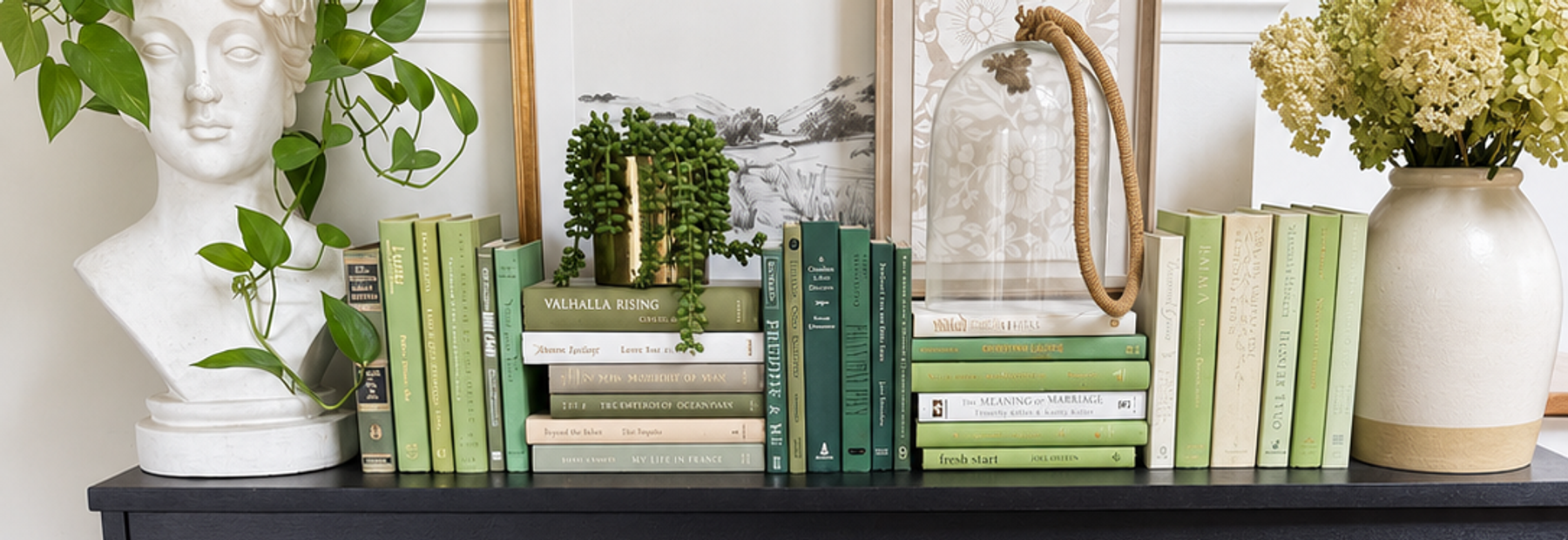 Curated collection of soft sage, olive, cream, and muted green books with botanical tones.