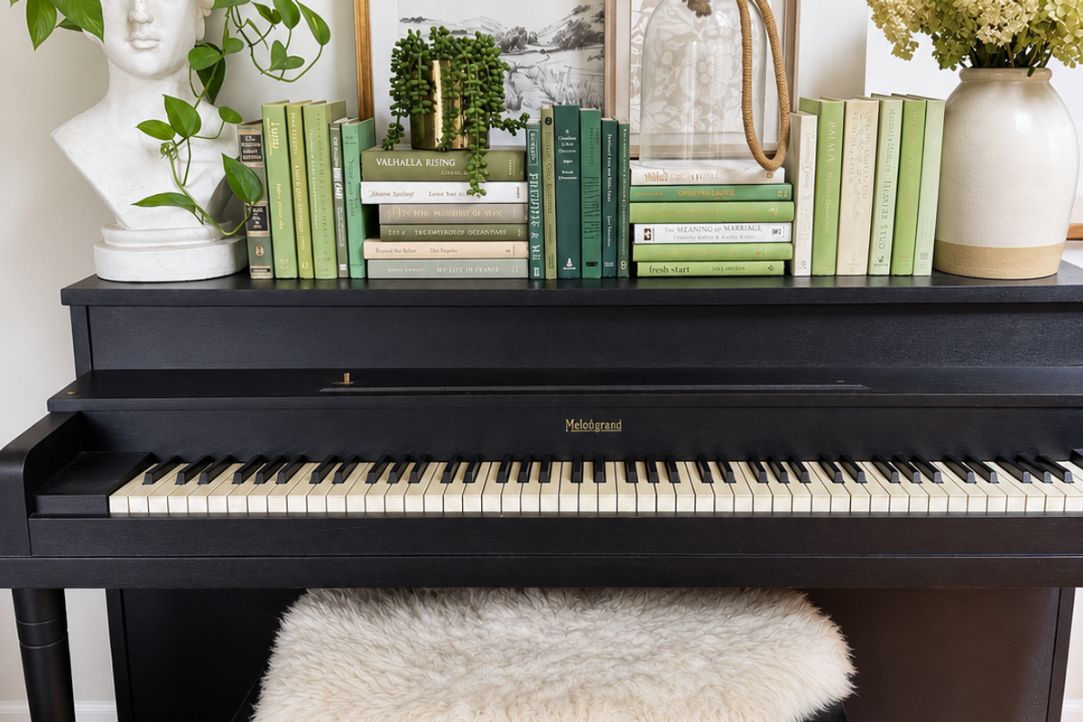 Curated collection of soft sage, olive, cream, and muted green books with botanical tones.