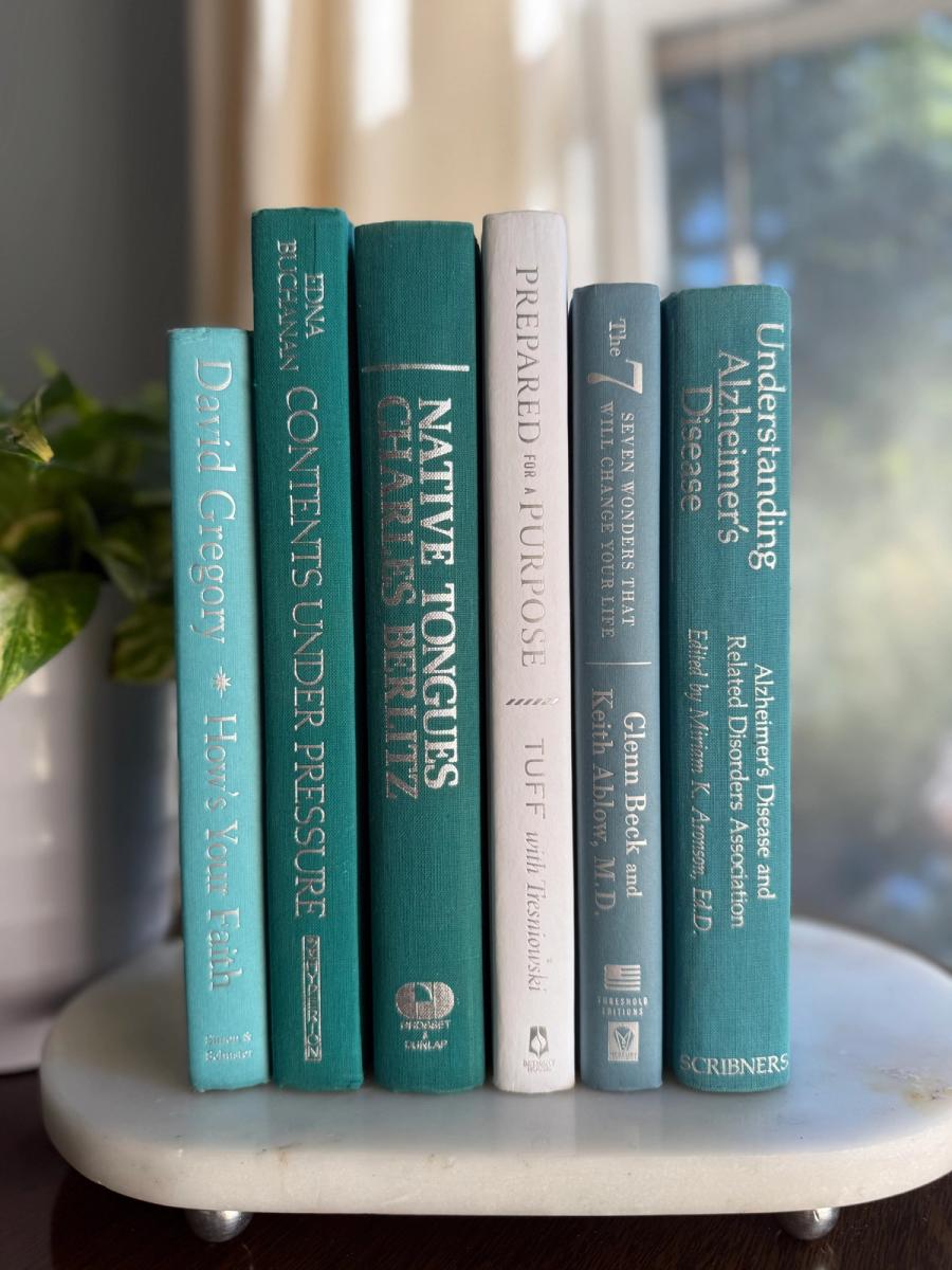 Curated collection of soft blue, aqua, seafoam, and muted coastal-toned books.