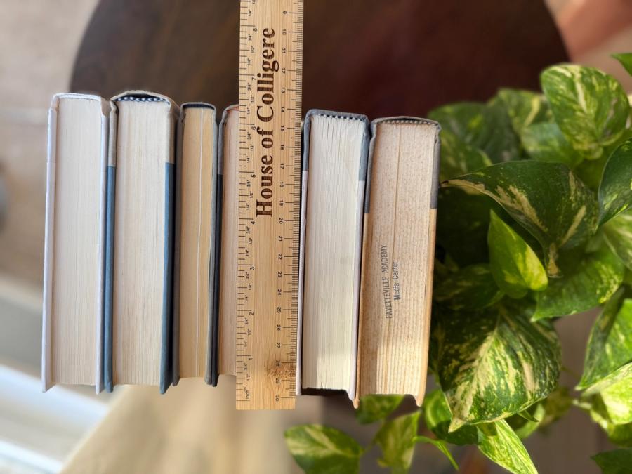 Curated collection of muted blue-gray, slate, charcoal, and softly weathered neutral books.