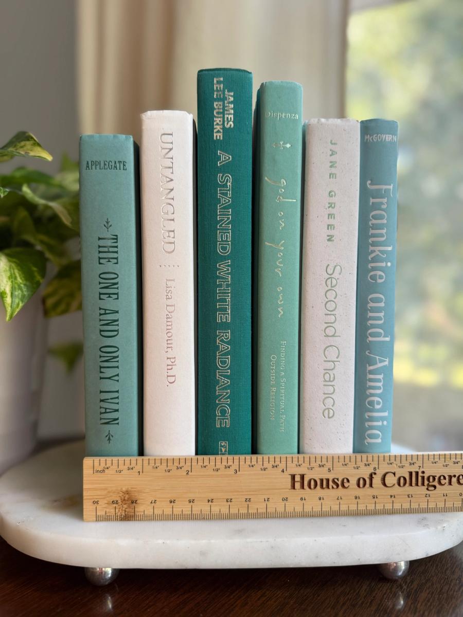 Curated collection of soft blue, aqua, seafoam, and muted coastal-toned books.