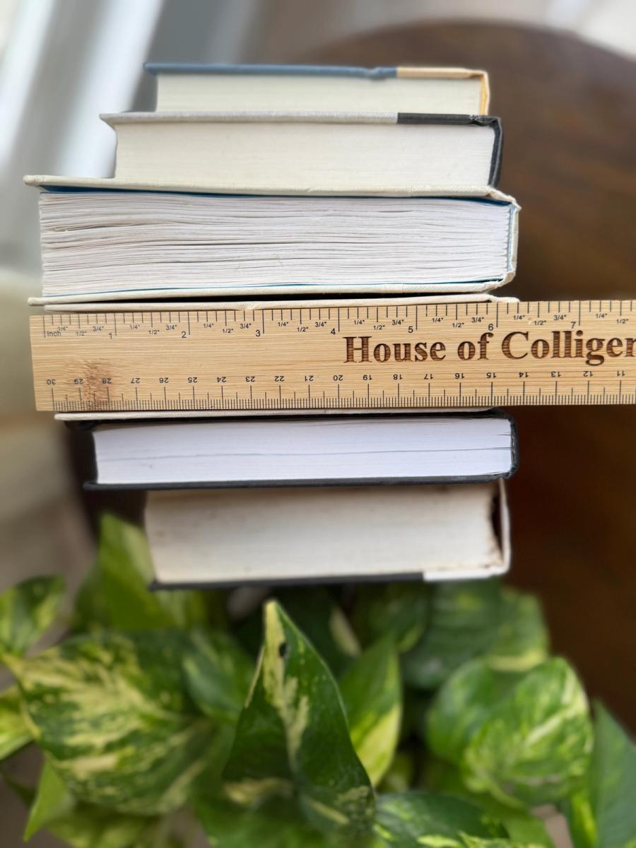 Curated collection of parchment, cream, warm beige, and black books with soft neutral contrast and classic detailing.