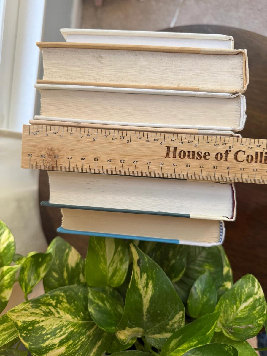 Curated collection of crisp white, ivory, and warm cream books with soft neutral tones.