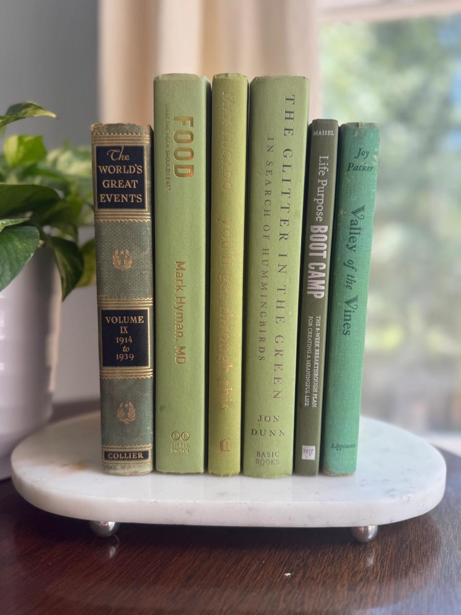 Curated collection of green books ranging from soft sage and olive to deeper botanical tones.