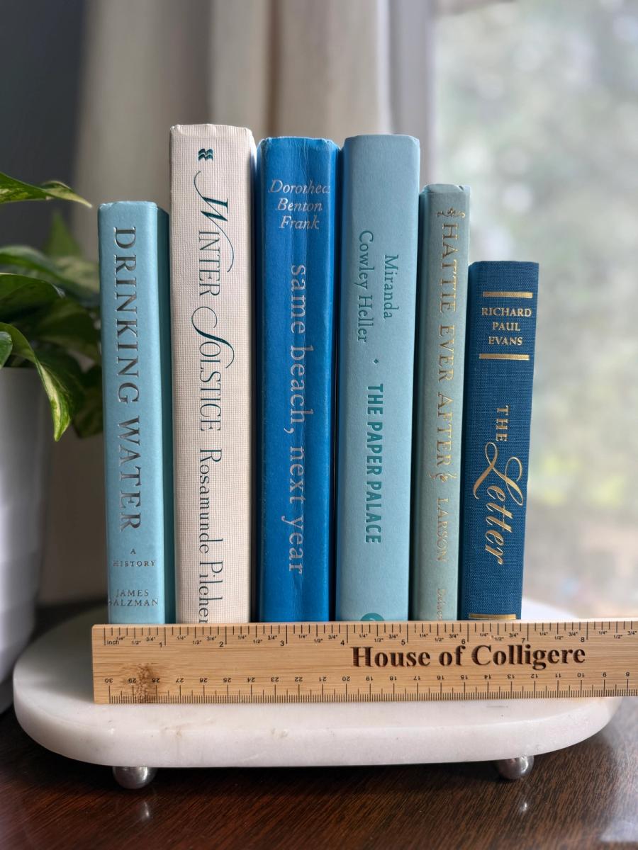 Curated collection of soft blue, aqua, seafoam, and muted coastal-toned books.