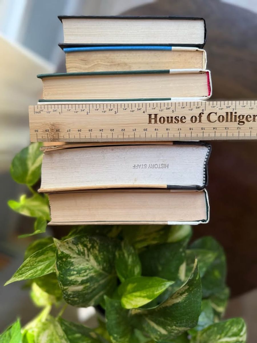 Curated collection of parchment, cream, warm beige, and black books with soft neutral contrast and classic detailing.