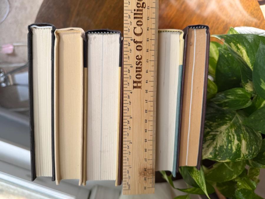 Curated collection of warm brown, olive, tan, and aged neutral books with a traditional library palette.