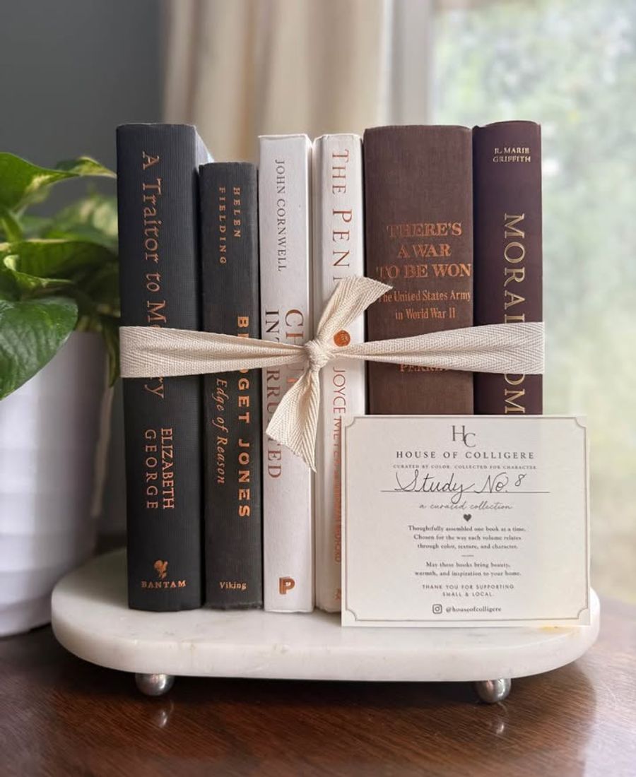 Curated collection of warm brown, olive, tan, and aged neutral books with a traditional library palette.
