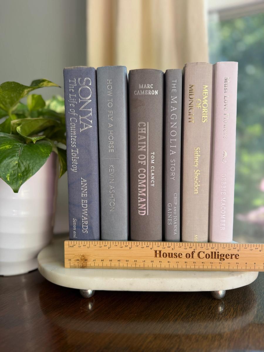 Curated collection of muted blue-gray, slate, charcoal, and softly weathered neutral books.