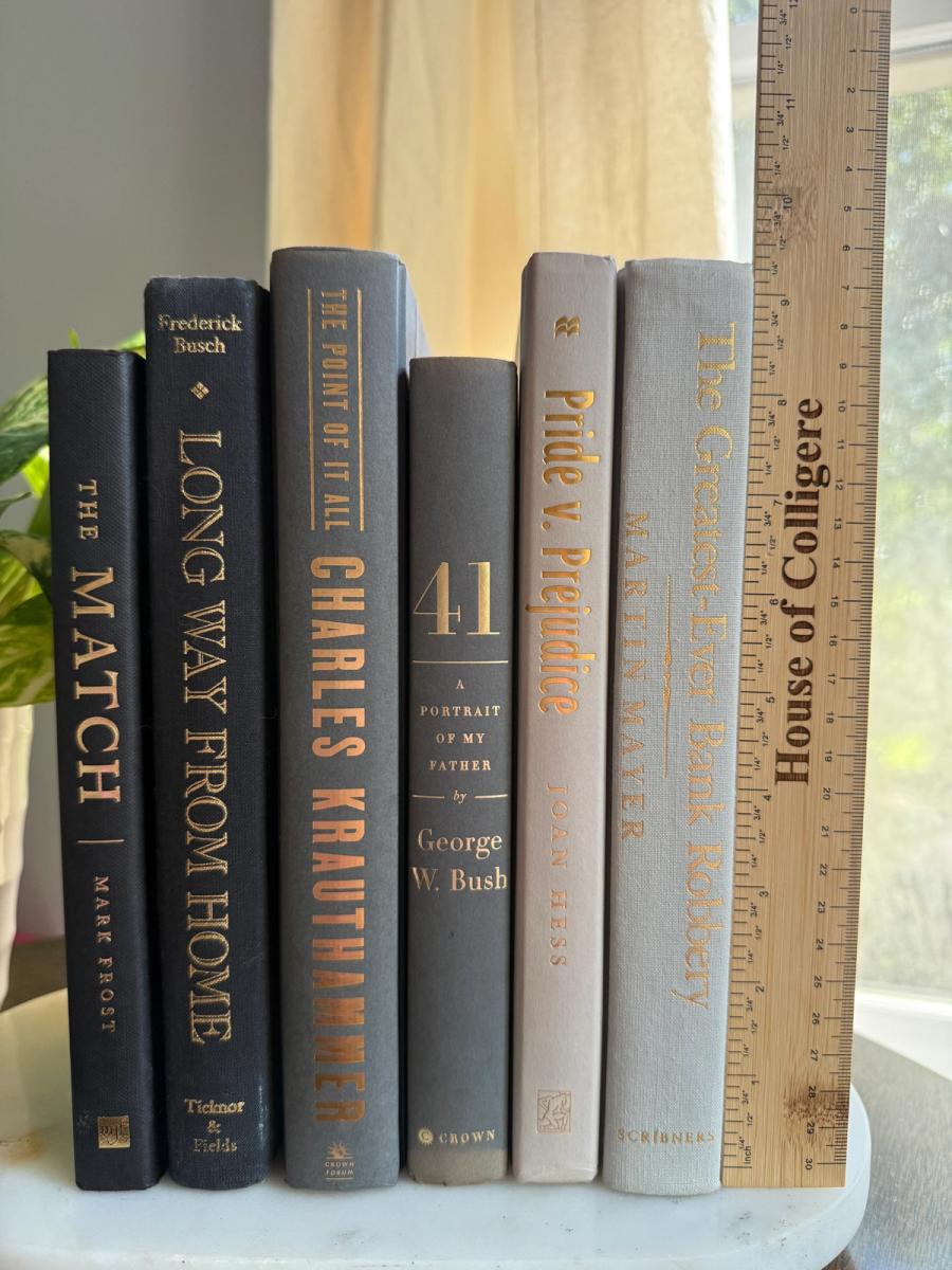 Curated collection of warm brown, olive, tan, and aged neutral books with a traditional library palette.
