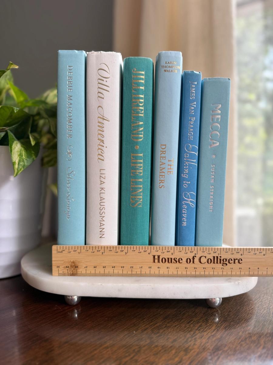 Curated collection of soft blue, aqua, seafoam, and muted coastal-toned books.