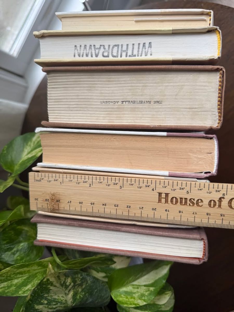 Curated collection of blush, dusty rose, warm taupe, and softly muted neutral books.