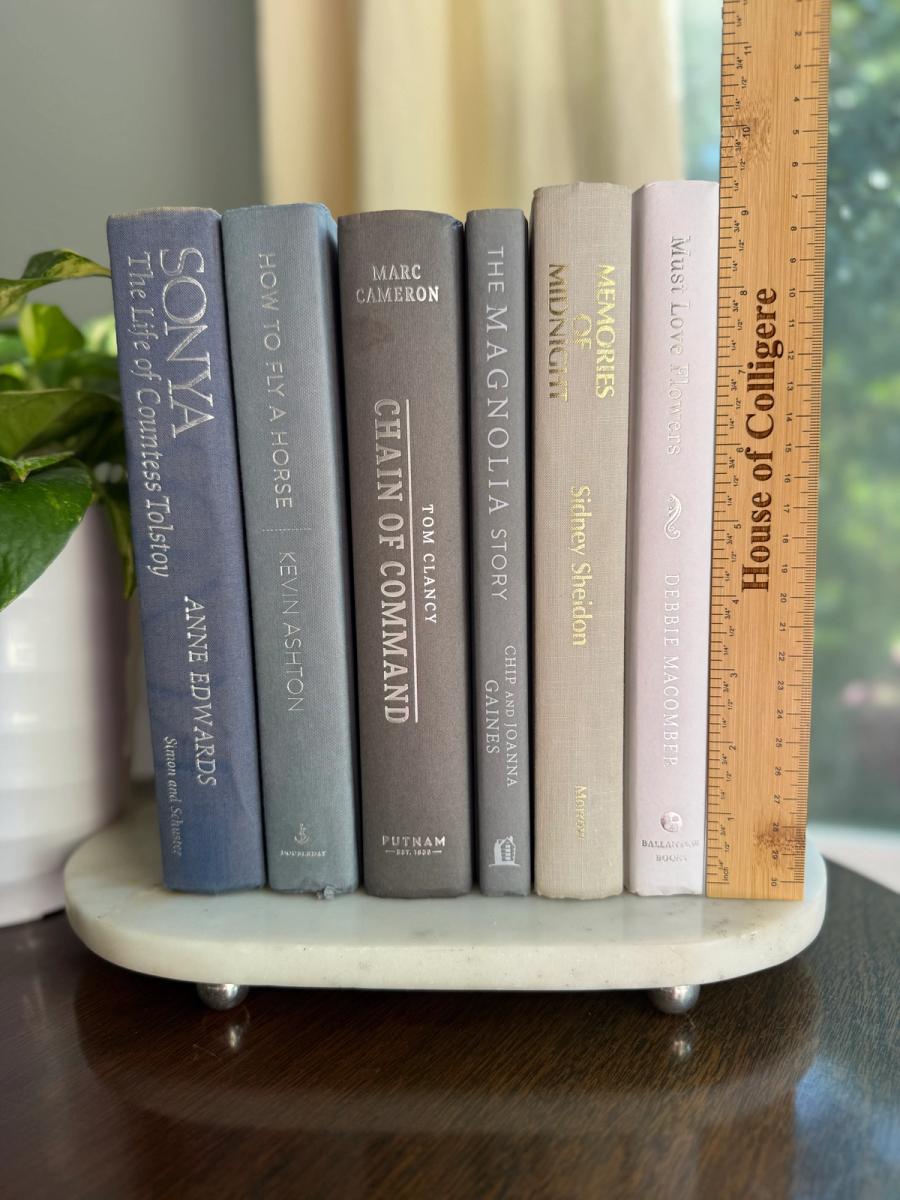 Curated collection of muted blue-gray, slate, charcoal, and softly weathered neutral books.